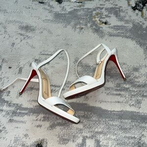 White Louboutin heels
